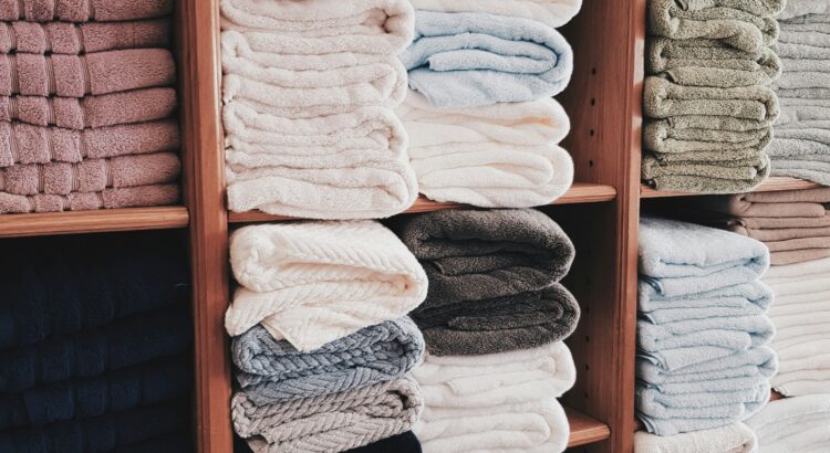 Picture of stacks of towels in different muted colors